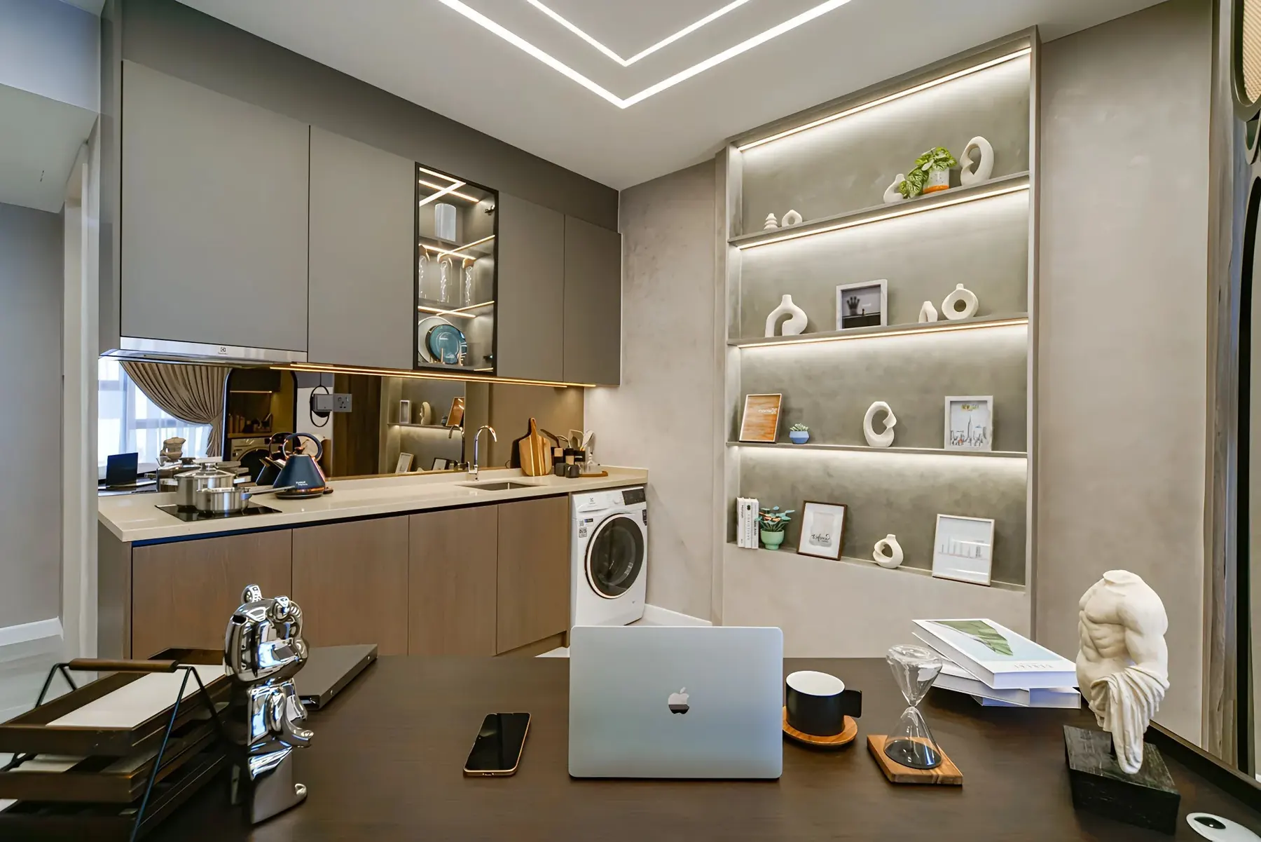 Furnished workspace and kitchen area in the Centrix KLCC show suite